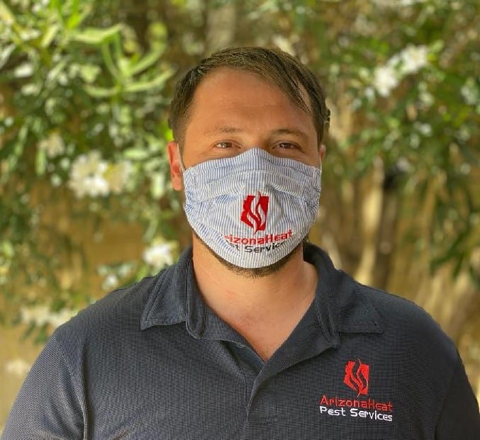 mesa bed bug exterminator wearing mask for bed bug treatment